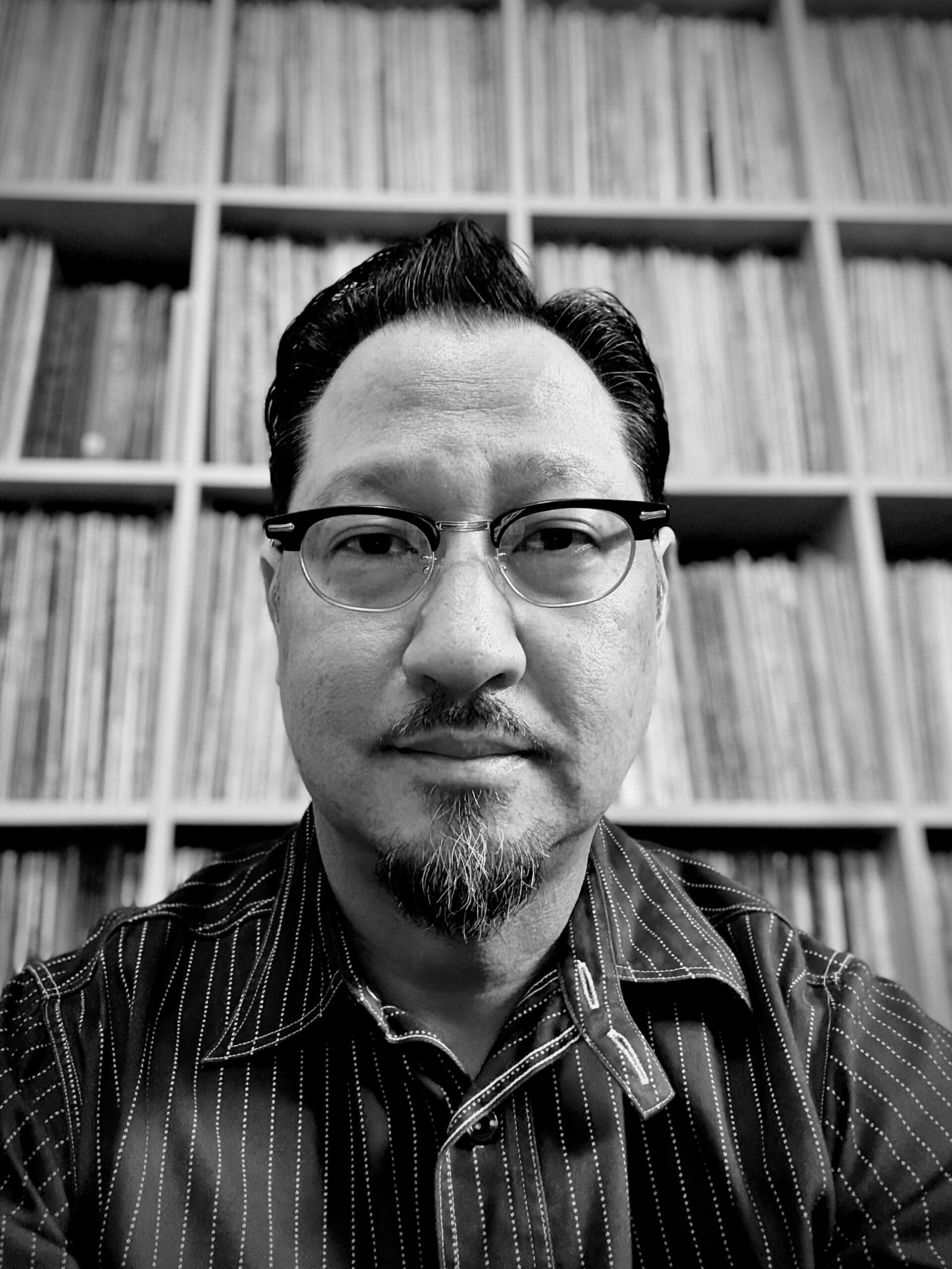 art-gallery-56 Steve Lee Bio picture in front of his record collection.